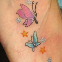 Blue and pink small butterfly tattoo with stars