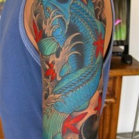 Blue koi fish tattoo on arm