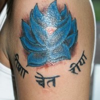 Blue lotus with hindu writings tattoo