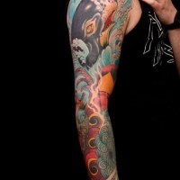 Tatuaje en el brazo de una ballena ballena azul por Jimmy Duvall.