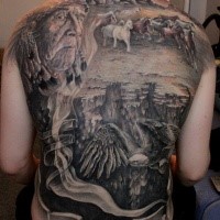 Breathtaking American native colored whole back tattoo of old Indian with running horses in desert and flying eagle
