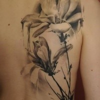 Breathtaking black and white back tattoo of sweet flowers