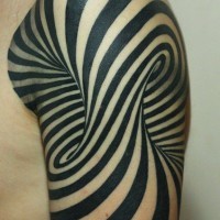 Breathtaking black and white hypnotic tattoo on shoulder