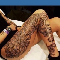 Breathtaking designed and painted very detailed floral tattoo stylized with ornaments on whole leg