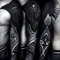 Breathtaking detailed black ink saturated sleeve tattoo of various ornaments