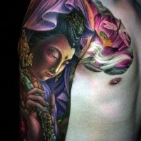 Breathtaking illustrative style colored shoulder tattoo of Buddha with lotus flower
