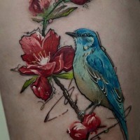 Breathtaking looking beautiful painted colored blooming tree tattoo combined with little bird