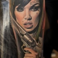 Breathtaking looking colored forearm tattoo of sexy woman with revolver