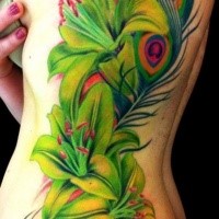 Breathtaking new school style big peacock feather tattoo on side combined with flowers