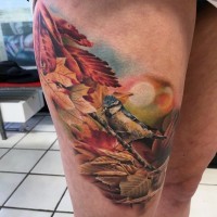 Breathtaking painted very realistic looking colored little bird with tree tattoo on thigh