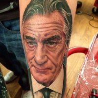 Breathtaking real photo like forearm tattoo of Robert De Niro