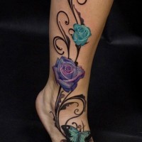 Breathtaking realistic looking beautiful flowers tattoo on leg stylized with buterfly