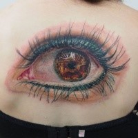 Breathtaking very detailed back tattoo of large woman eye