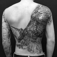 Breathtaking very detailed black and white whole back tattoo of glorious eagle