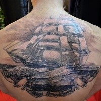 Breathtaking very detailed upper back tattoo of big sailing ship with waves