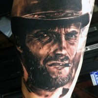 Breathtaking very realistic looking Clint Eastwood like cowboy tattoo on thigh