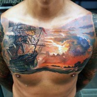 Tatuaje en el pecho,  barco espectacular detallado a puesta  del sol