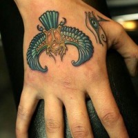 Bright colored specifically detailed Egyptian scarab and the Eye of Horus hand tattoo