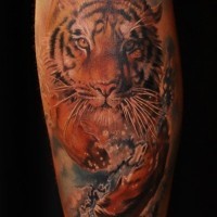 Brilliant designed and painted colored running tiger tattoo on leg