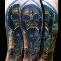 Brilliant multicolored sleeve tattoo of very detailed man in gas mask