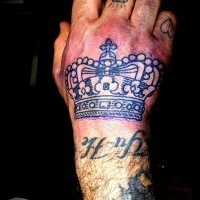 Brutal crown tattoo on the hand