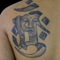 Buddha and hieroglyph tattoo on shoulder blade