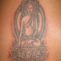 Buddha sitting on  lotus flower tattoo