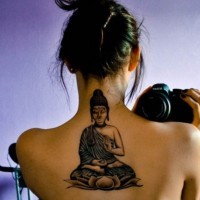 Buddha sitting on a lotus flower tattoo on back for girls