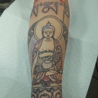 Buddha tattoo on arm