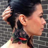 Bullfinch and red berries tattoo on neck