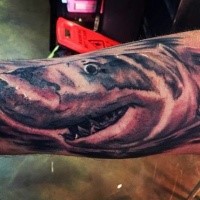 Carelessly painted big shark tattoo on leg