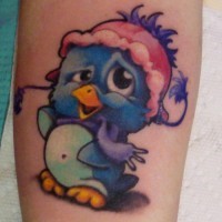 Cartoon blue penguin tattoo on wrist