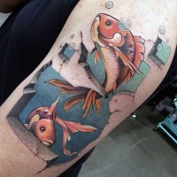 Cartoon like colored little fishes tattoo on shoulder area