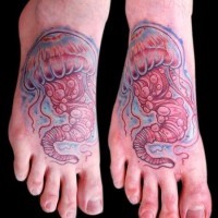 Cartoon like colored little jelly-fish tattoo on foot