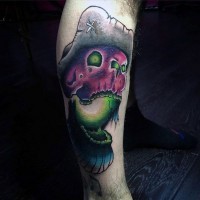 Cartoon like colored mystic sailors skull in hat tattoo on leg