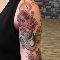 Cartoon like colored shoulder tattoo of mermaid with guitar and diamonds