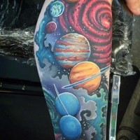 Cartoon like colored solar system tattoo on leg