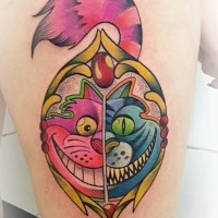 Cartoon like colored thigh tattoo of Cheshire cat portrait