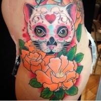 Cartoon like colorful Mexican style cat tattoo on arm stylized with flowers