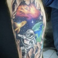 Cartoon like designed and colored little spaceman and planets tattoo on leg