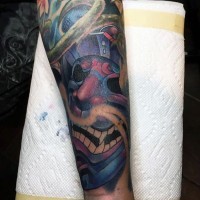 Cartoon like designed and colored smiling samurai mask tattoo on forearm