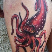 Cartoon like funny colored squid tattoo on thigh