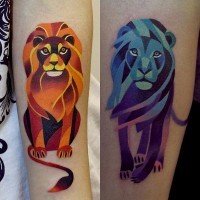 Cartoon like little multicolored lions tattoo on forearm