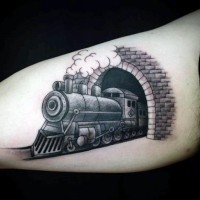 Cartoon like nice painted black and white old train in tunnel tattoo on arm
