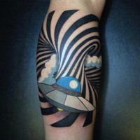 Cartoon like painted and colored little alien ship with hypnotic ornament tattoo on leg
