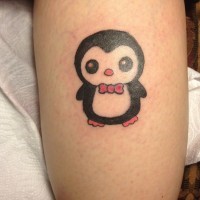 Cartoon penguin tattoo with red bow
