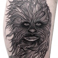 Cartoon style black ad white arm tattoo of Wookiee face