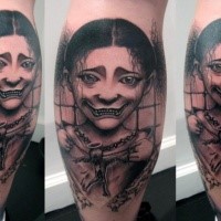 Cartoon style black ink leg tattoo of smiling creepy woman