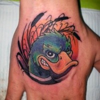 Cartoon style colored angry duck tattoo on hand