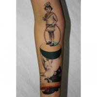 Cartoon style colored arm tattoo of interesting figure